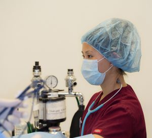 Nurse anesthetist monitoring anesthesia