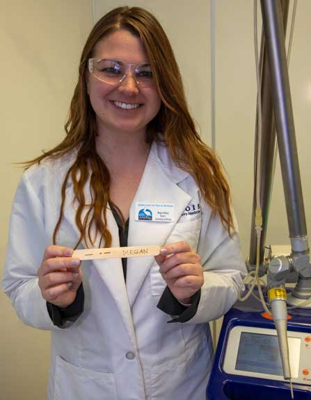 Student learning how to use the surgical laser