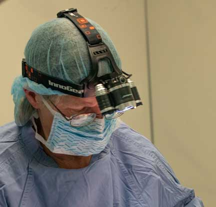 Surgeon with magnifying light