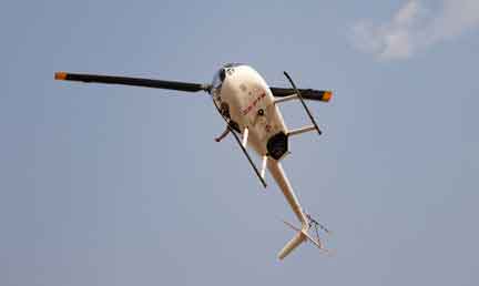 Andre giving a thumbs up in the helicopter while flying